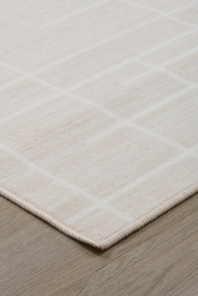 Ljusbeige polyamidmatta med grafiskt mönster.