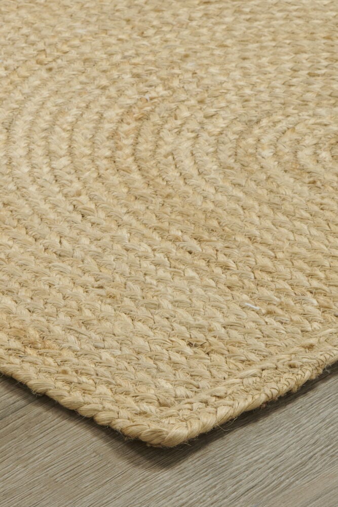 Puolikuun muotoinen ovimatto hiekanvärisestä juutista.