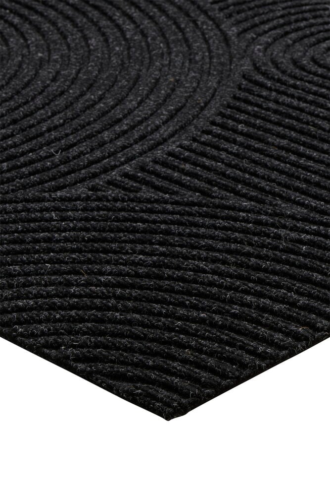 Mörkgrå dörrmatta med rundade mönster och struktur.