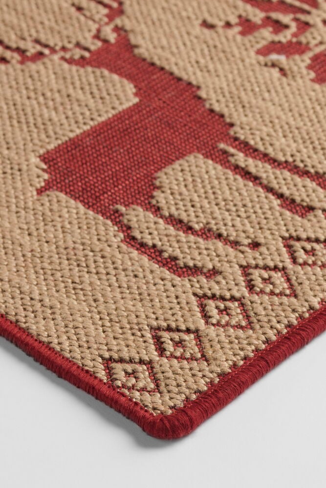 Sand Jute Teppich, beige mit rotem Hirsch- und geometrischem Muster, mit roter Umrandung.