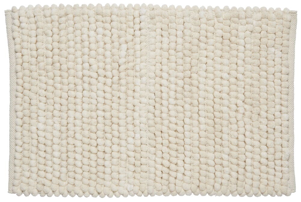 Suorakulmainen beige kylpyhuonematto, jossa on pehmeä rakenne.