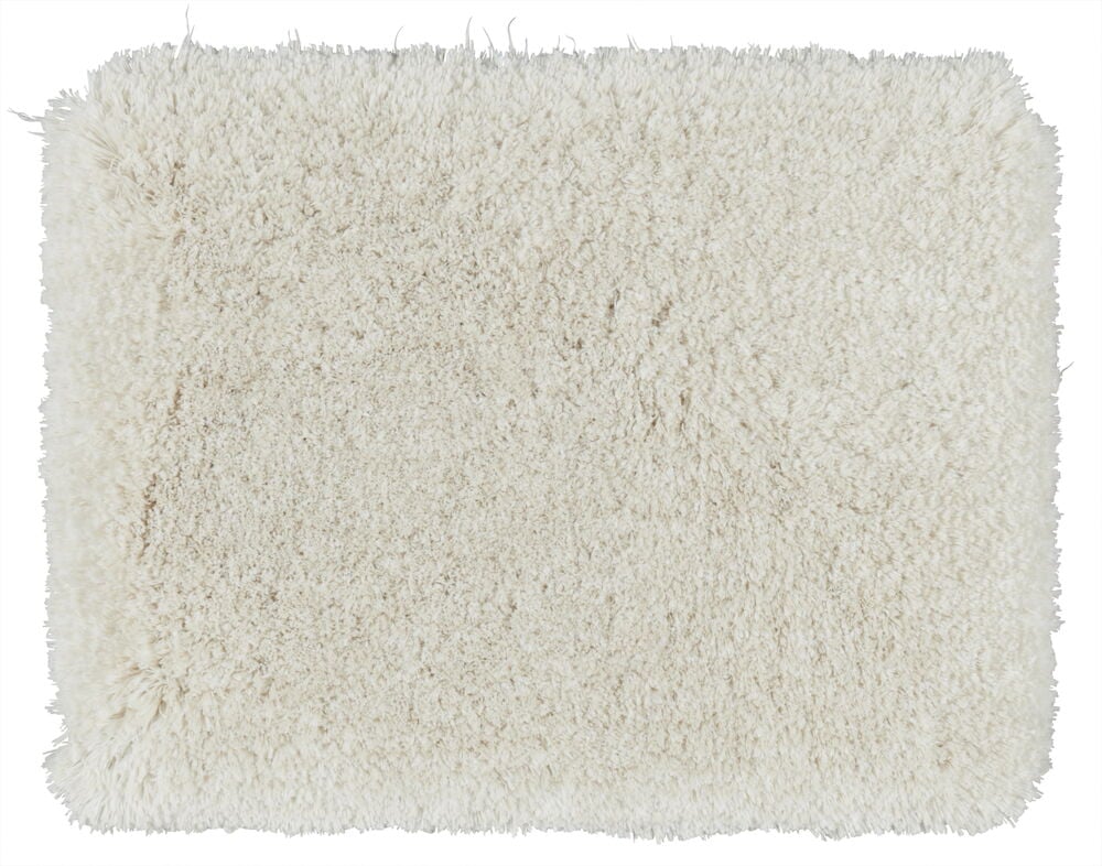 Suorakulmainen beige kylpyhuonematto, jossa on pehmeä karvainen pinta.