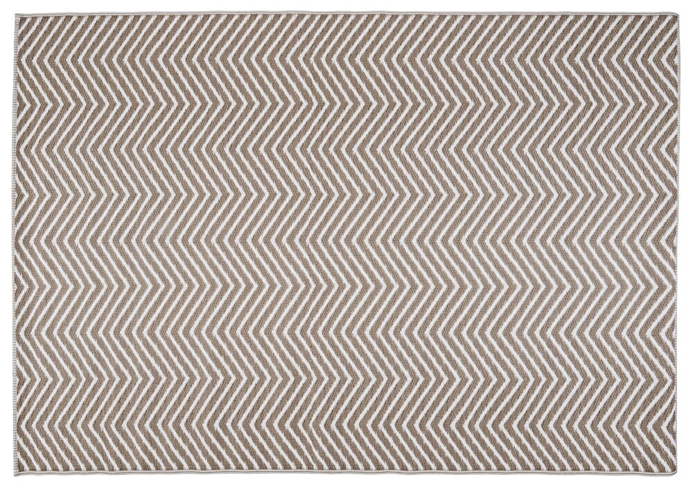 Ljusbrun rektangulär matta med zickzackmönster.