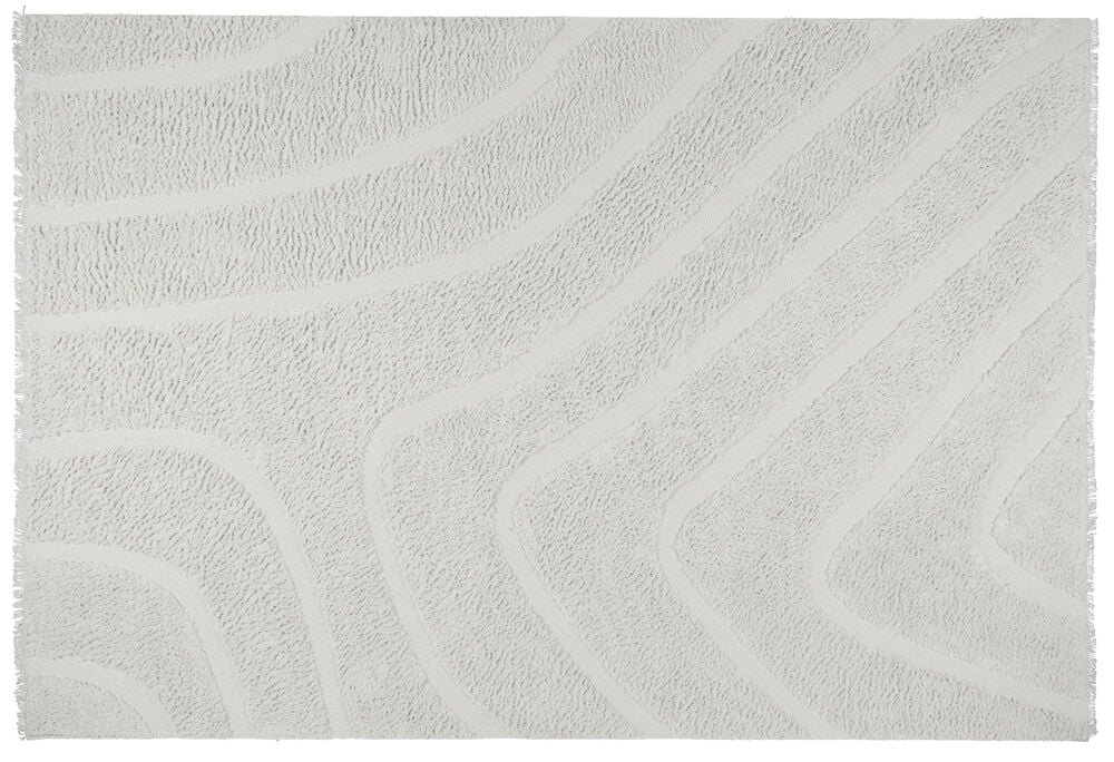 Stor vit matta med organiskt mönster och franskant.