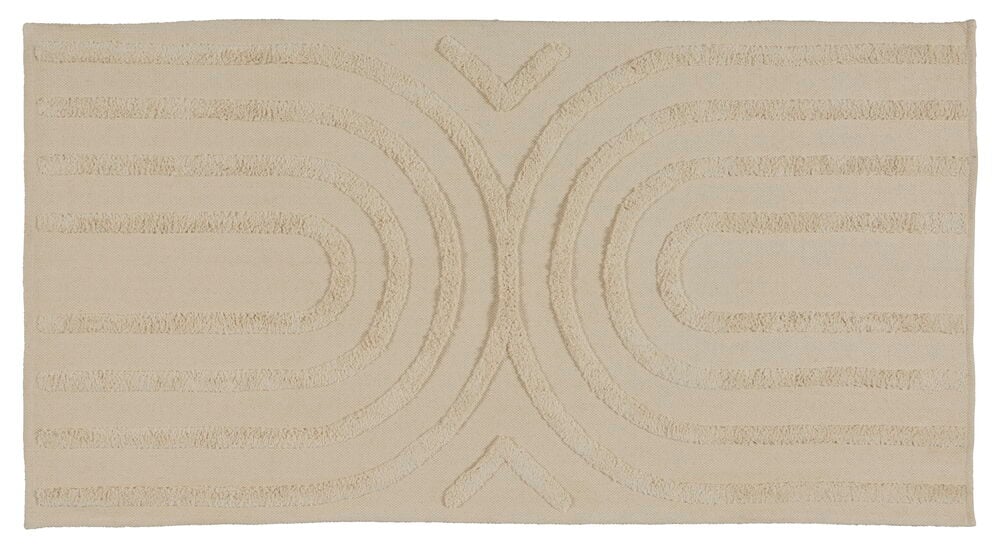 Beige gångmatta med böljande tuftat mönster.