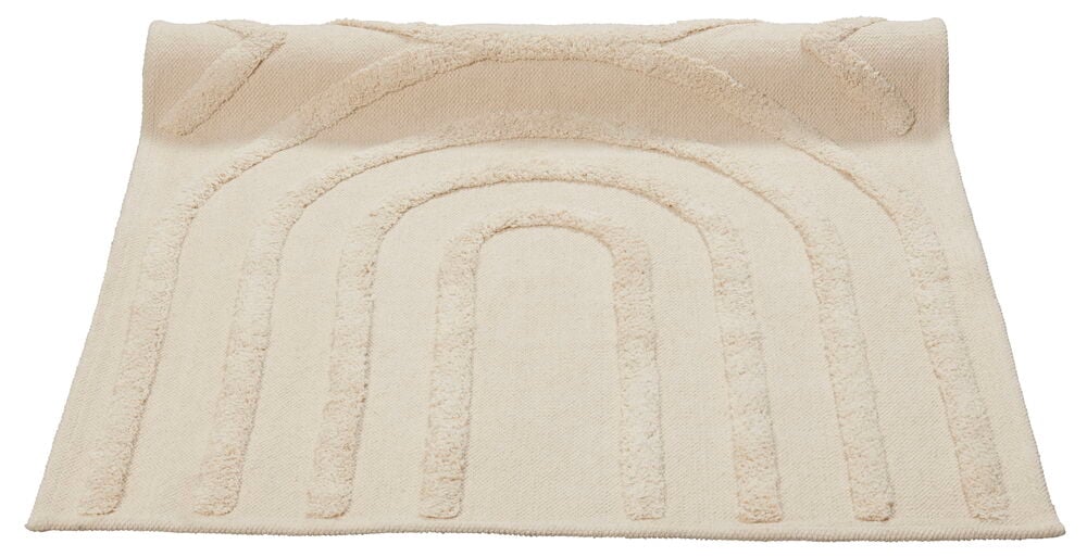 Beige gångmatta med böljande tuftat mönster.