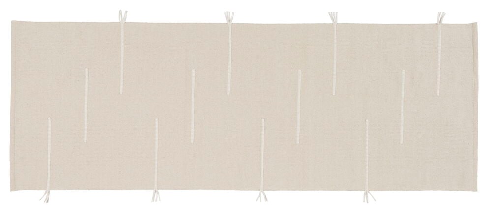 Handvävd naturfärgad bomullsmatta med diskret flätmönster.