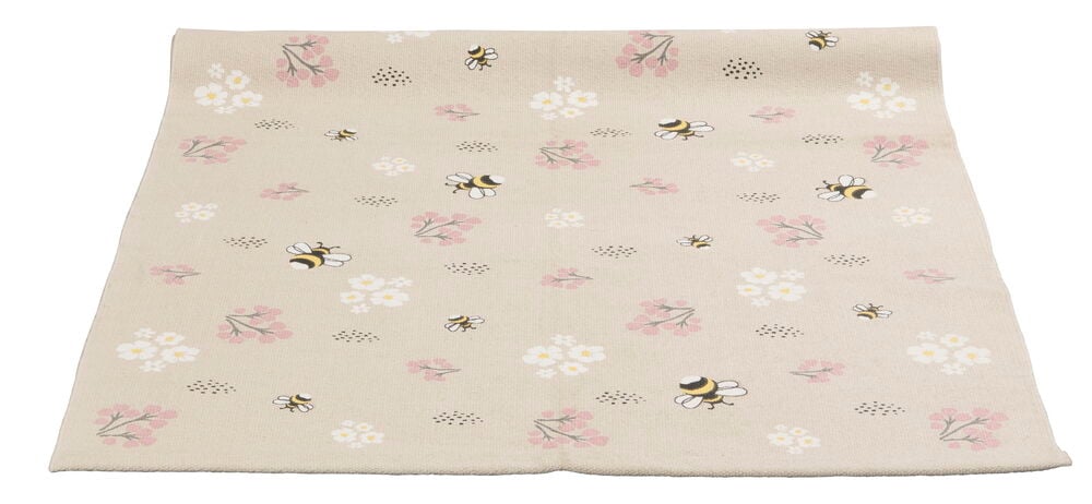 Beige muslinfilt med bin och blommor motiv.