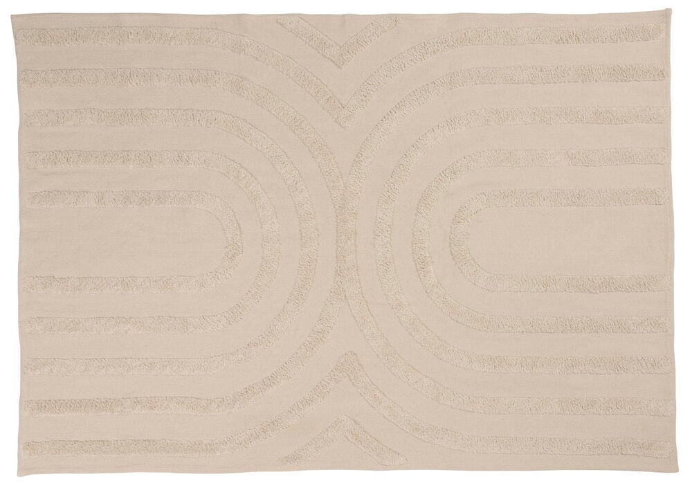 Beige matta med symmetriskt mönster och struktur.