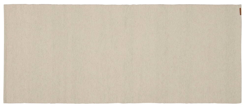 Suorakulmainen beige villamatto, jossa on sileä pinta.