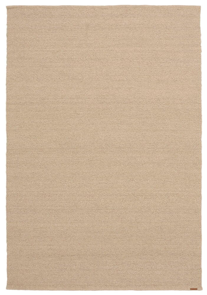 En beige rektangulär Elsaform Bonnie matta i ullblandning med synlig textur.