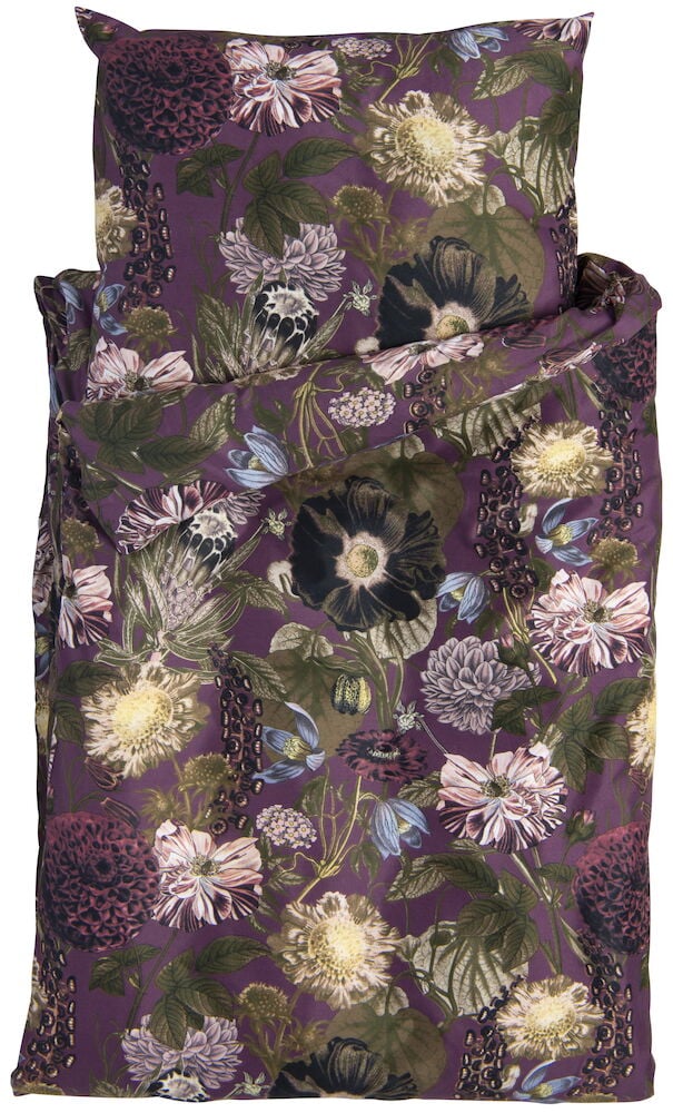 Påslakanset med blommigt mönster på lila bakgrund.