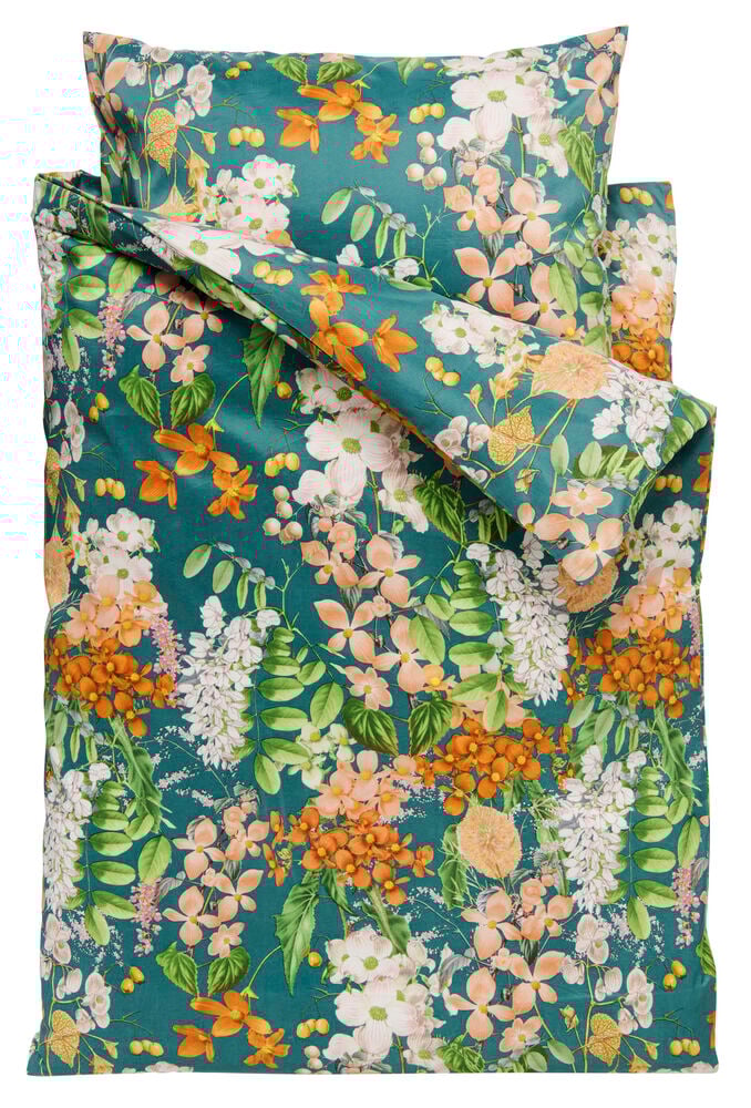 Grönt påslakanset med blommigt Eloise-mönster.