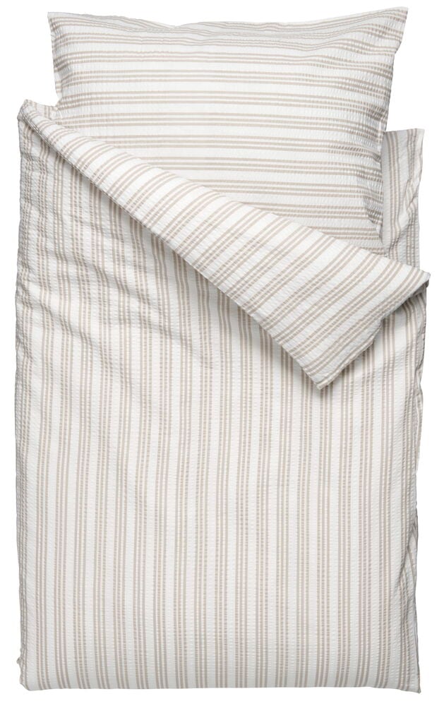 Raidallinen beige puuvillainen pussilakanasetti, jossa tyynyliina.