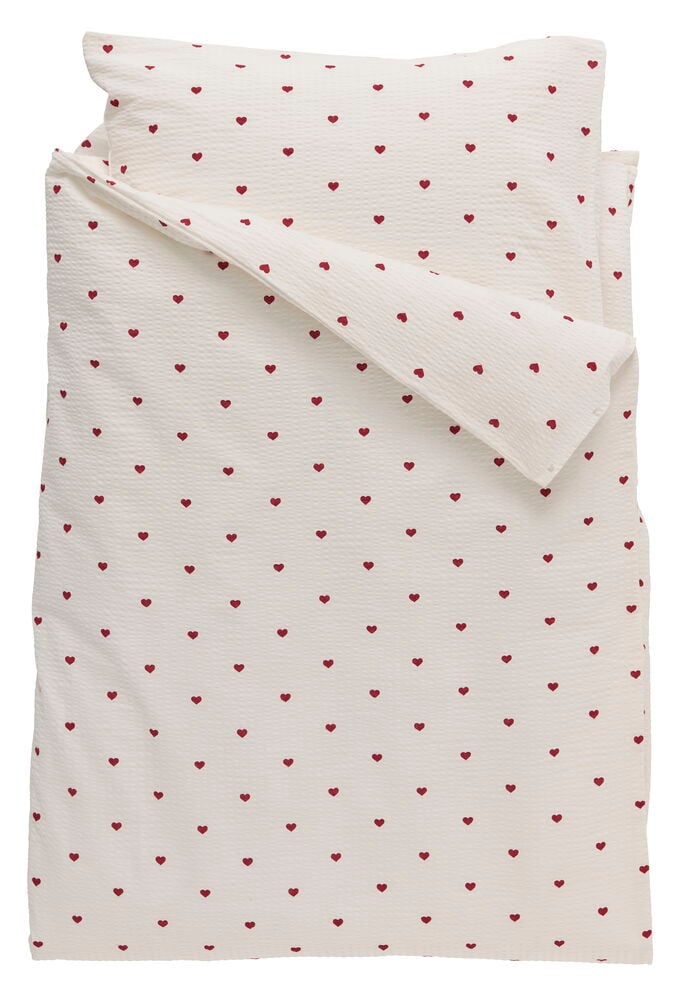 Påslakanset Becky 150x200 cm Hjärta Bomull Hjärta, ett vikt beige set med små röda hjärtan.
