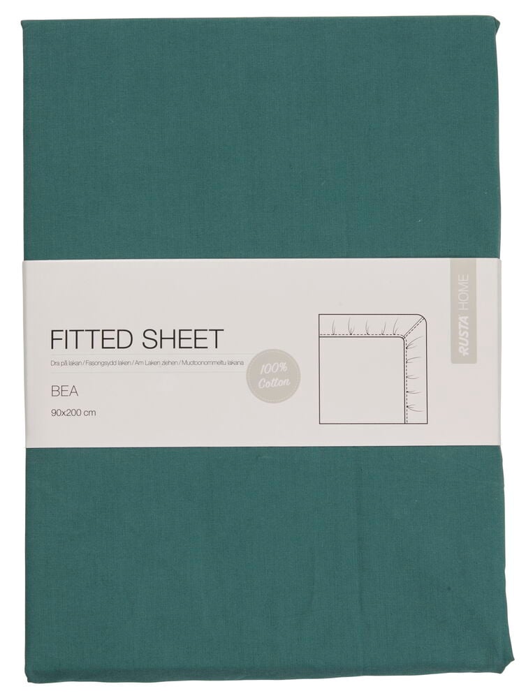 Grünes Spannbettlaken mit Etikett.