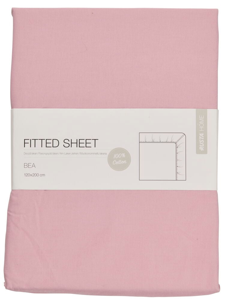 Ett vikt gammelrosa bomullslakan med pappersband.