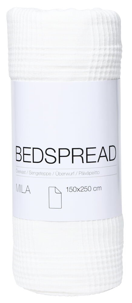 Hvitt sengeteppe med innvevd rutemønster sammenrullet.