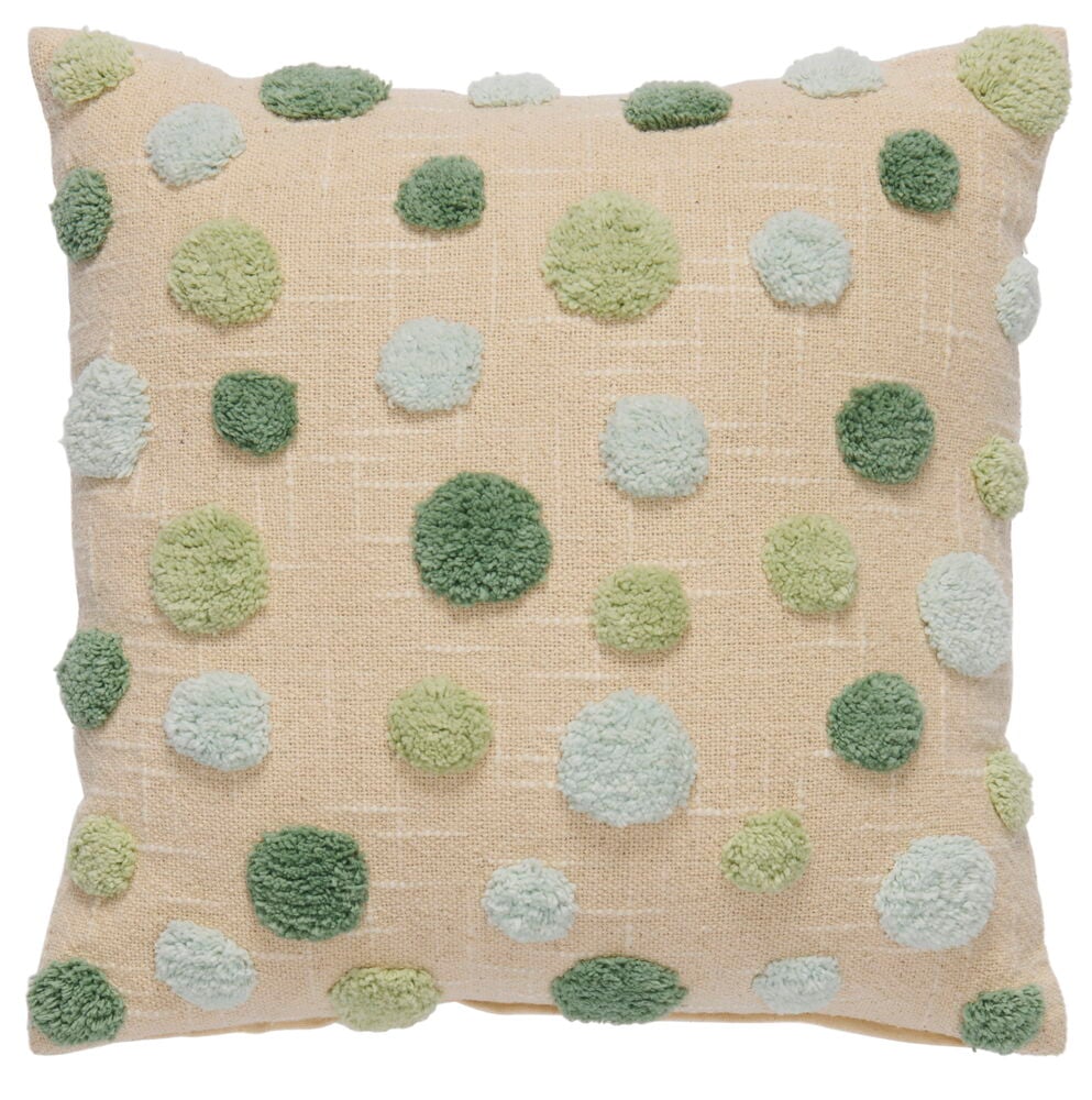 Vihreä tyyny, jossa on vihreitä ja vaaleansinisiä pilkkuja.