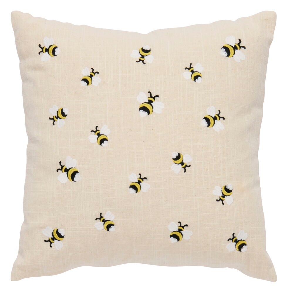 Beiges Kissen mit gestickten Bienen auf der Vorderseite.