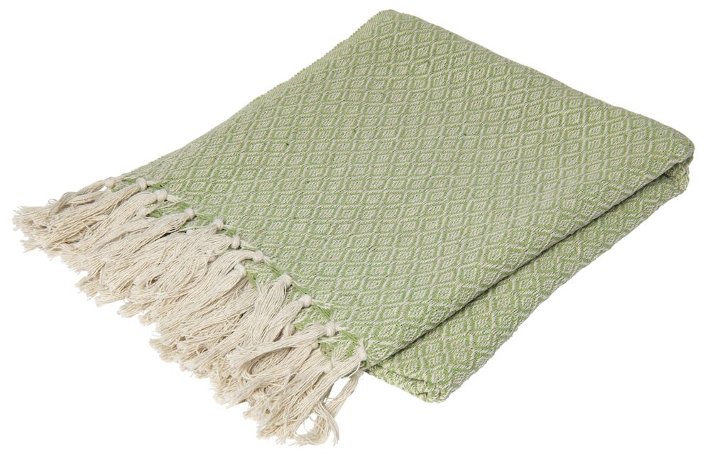 Grüne Decke mit Fransen und Diamantmuster.