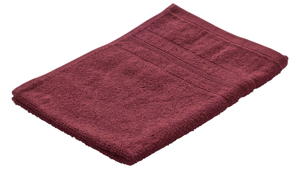 Taitettu Old burgundy Emma 50x70 cm puuvillakäsipyyhe, jossa näkyy froteepinta ja uurrettu reuna.
