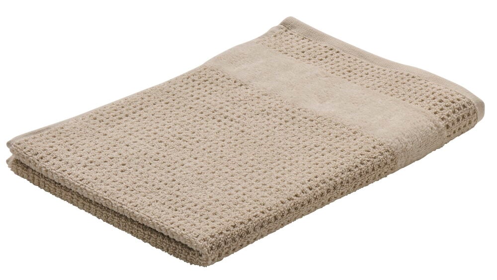 Beige paino keittiöpyyhe puuvillaa, jossa on rakennekuvio.