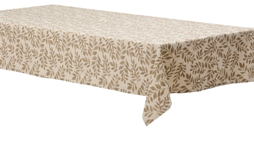 Pöytä luonnonvärisellä pöytäliinalla, jossa on lehtikuvio.