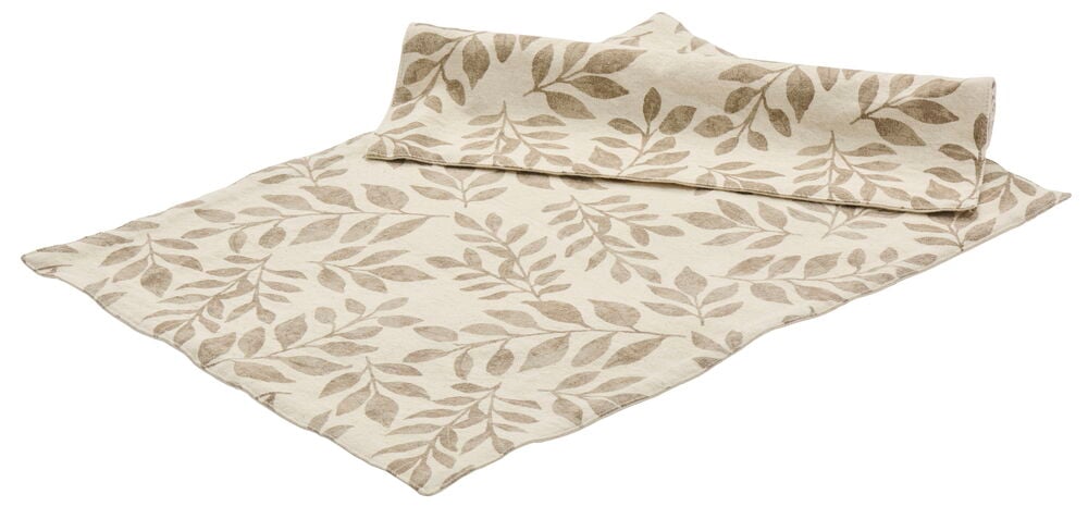 Zwei naturfarbene Tischsets mit Blattmotiv aus Baumwolle.