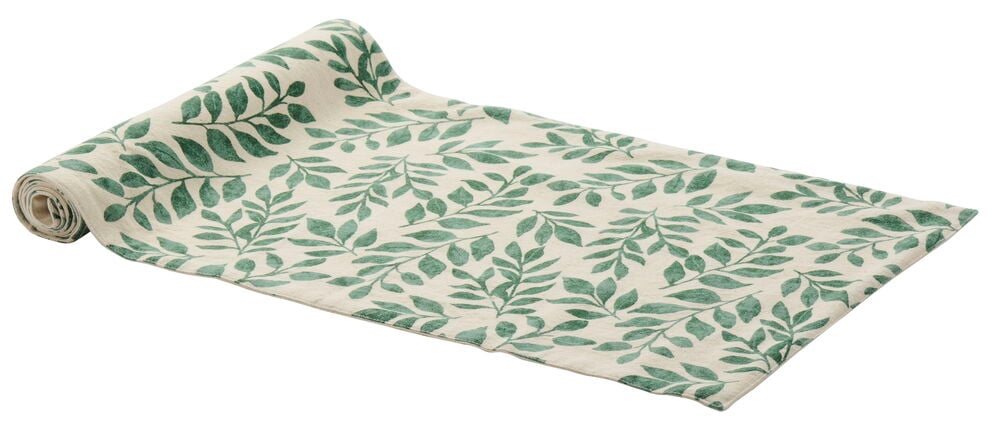Bordslöpare i bomull med grönt bladmotiv.