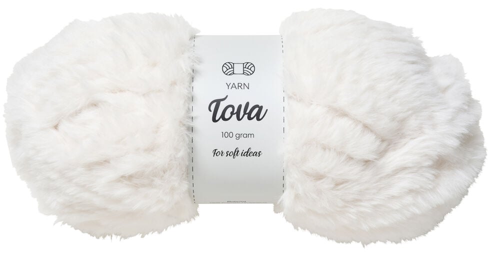 Ein weißes Knäuel weiches Garn mit Etikett.