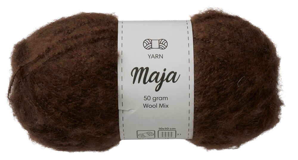 En brun, fluffig nystan Maja garn med vit etikett, 50 gram Ull Mix.