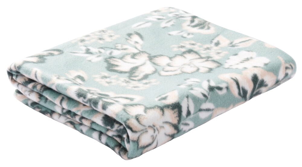 Vekt grønn fleecepledd med blomstermønster.