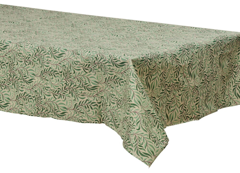 Grønn- og hvitstripet voksduk med bladmotiv på bord.