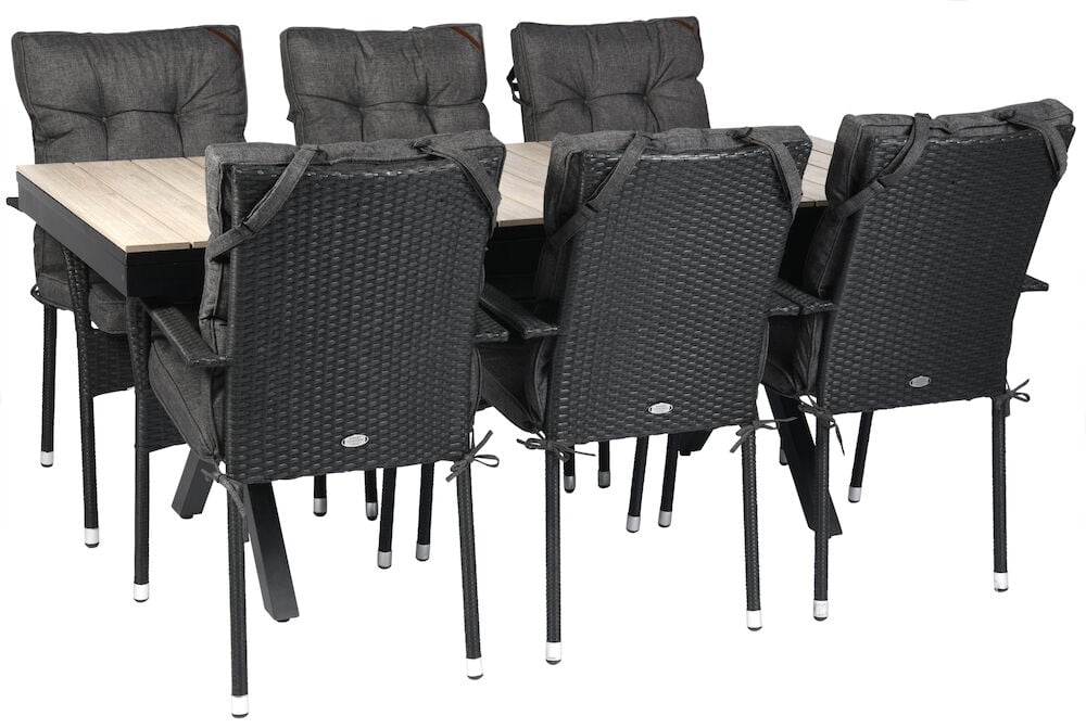 Svart utdragbart bord med sex svarta stolar.