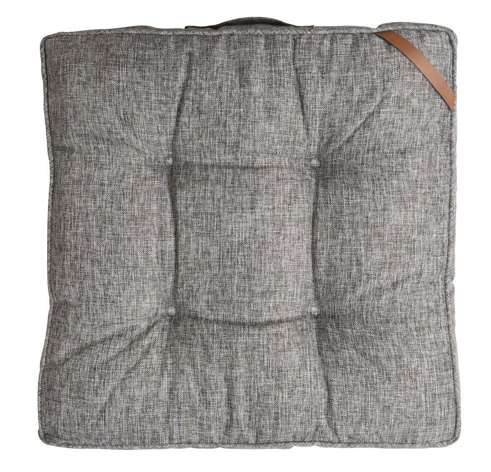 Harmaa nelikulmainen istuinpehmuste, jossa on kahva ylhäällä.