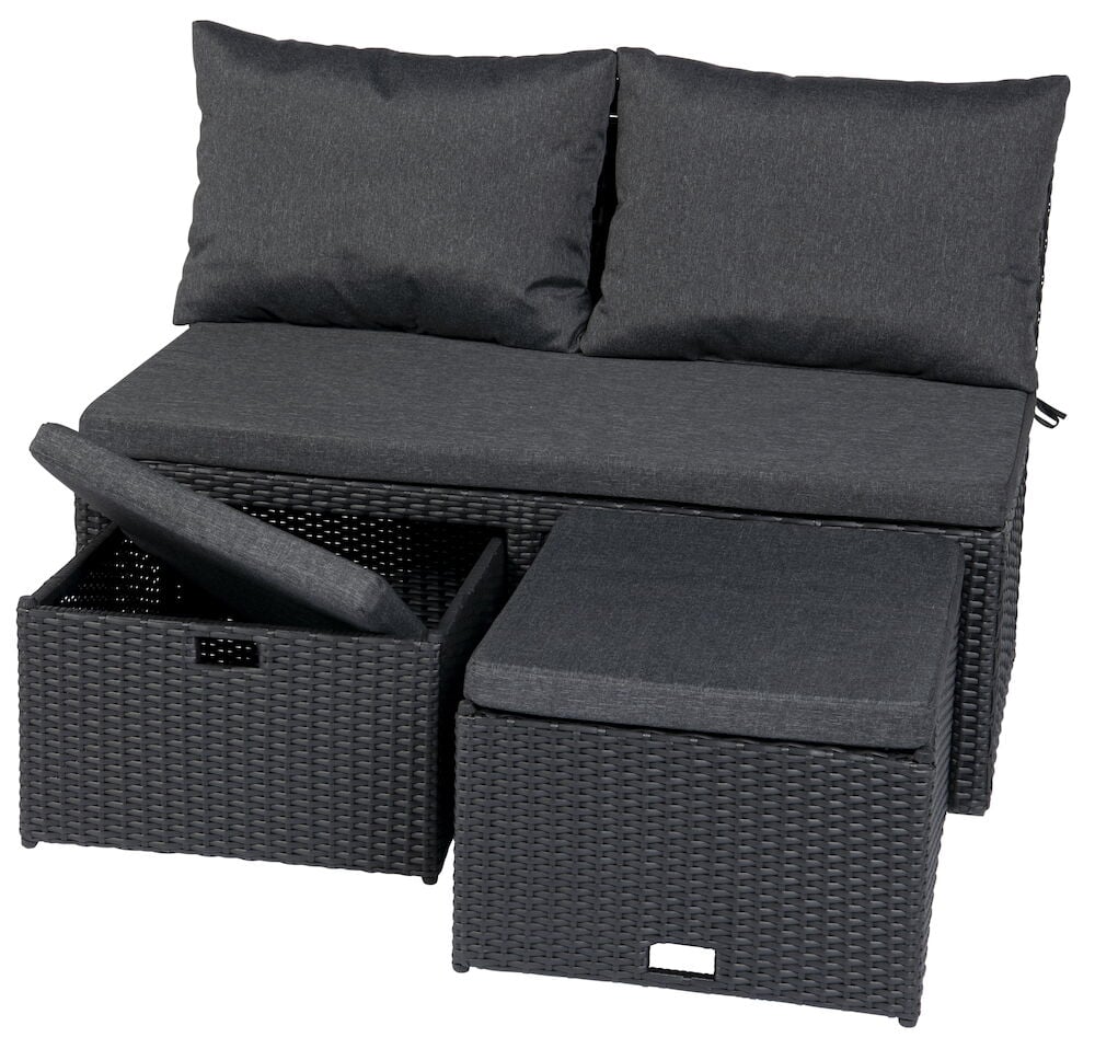 Svart loungesofa med puter og to oppbevaringsbokser.