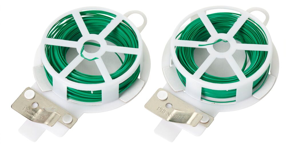Zwei Rollen grüner, kunststoffbeschichteter Bindfaden in weißem Halter.