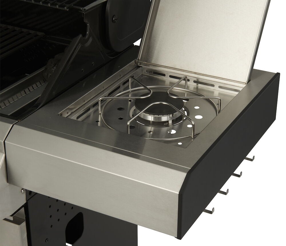 Sidobrännare i rostfritt stål med öppet lock.