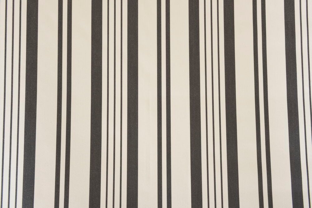 Grå och vita lodräta ränder på markisväv.