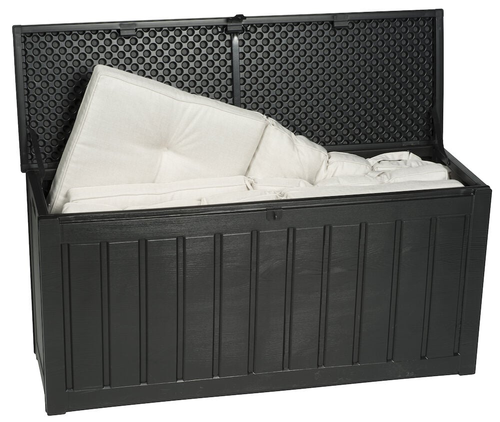 Musta muovilaatikko avoimella kannella ja valkoisia tyynyjä.