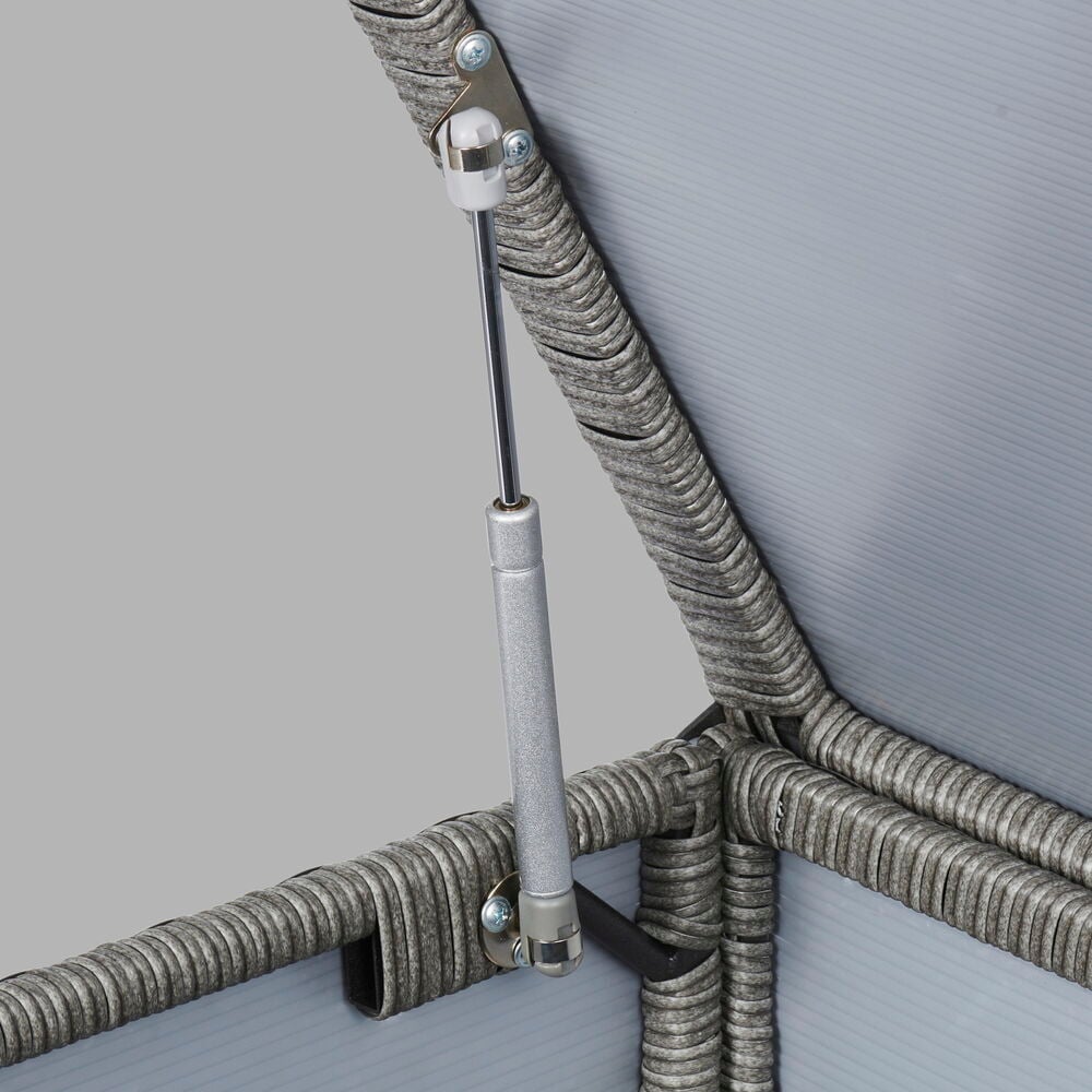 Närbild på grå konstrotting förvaringslåda med gasfjäder.