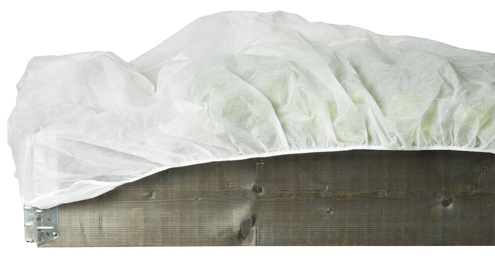 Valkoinen kuitukangas, jossa on jousto puulavakehyksen päällä.