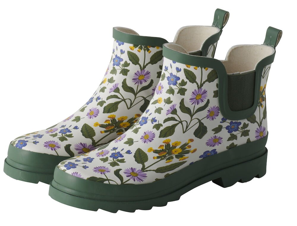 Gummistiefel Ines mit weißem Blumenmuster in verschiedenen Farben, dunkelgrünem Rand und Sohlen.