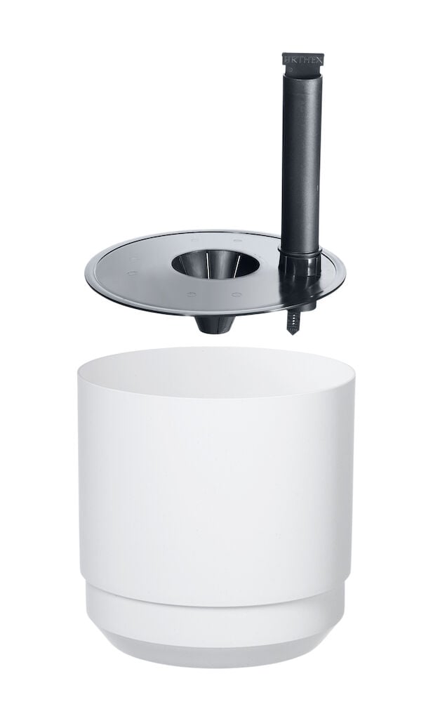 Valkoinen itse-kasteleva ruukku mustalla sisäosalla ja osoittimella.