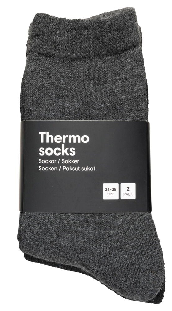 Två par tjocka mörkgrå värmesockor ihopvikta.