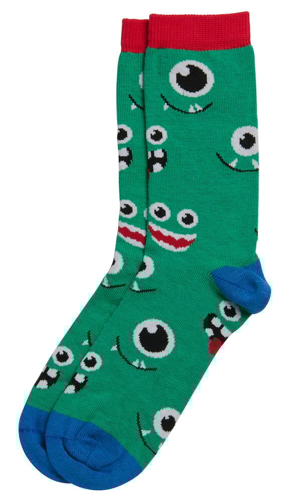 Grüne Socken mit roten Bündchen und blauen Zehen, gemustert mit verschiedenen Cartoon-Monstergesichtern.