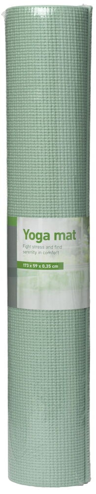 Upprullad grön yogamatta med räfflad yta.