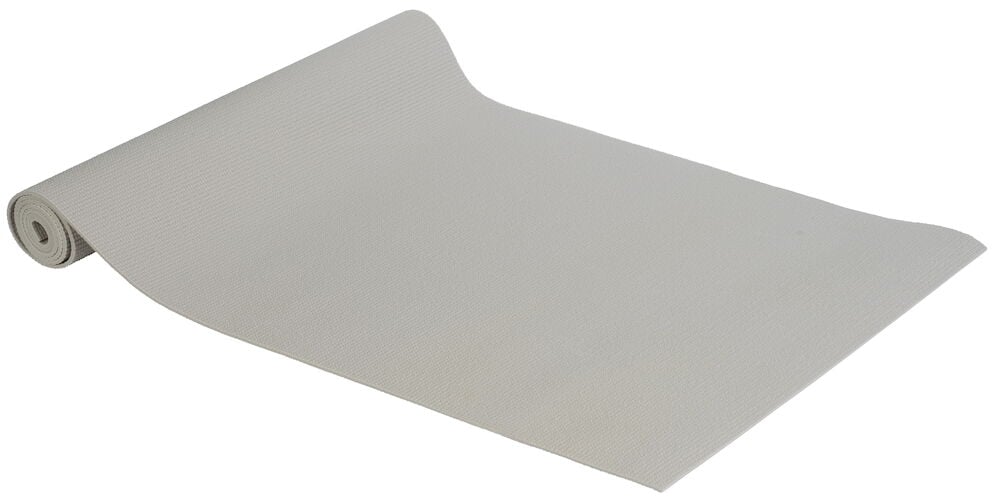 Ljusgrå yogamatta av PVC delvis utrullad.