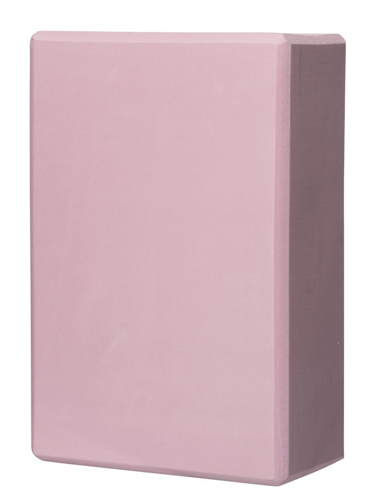Rosa yogablock med rundade kanter.